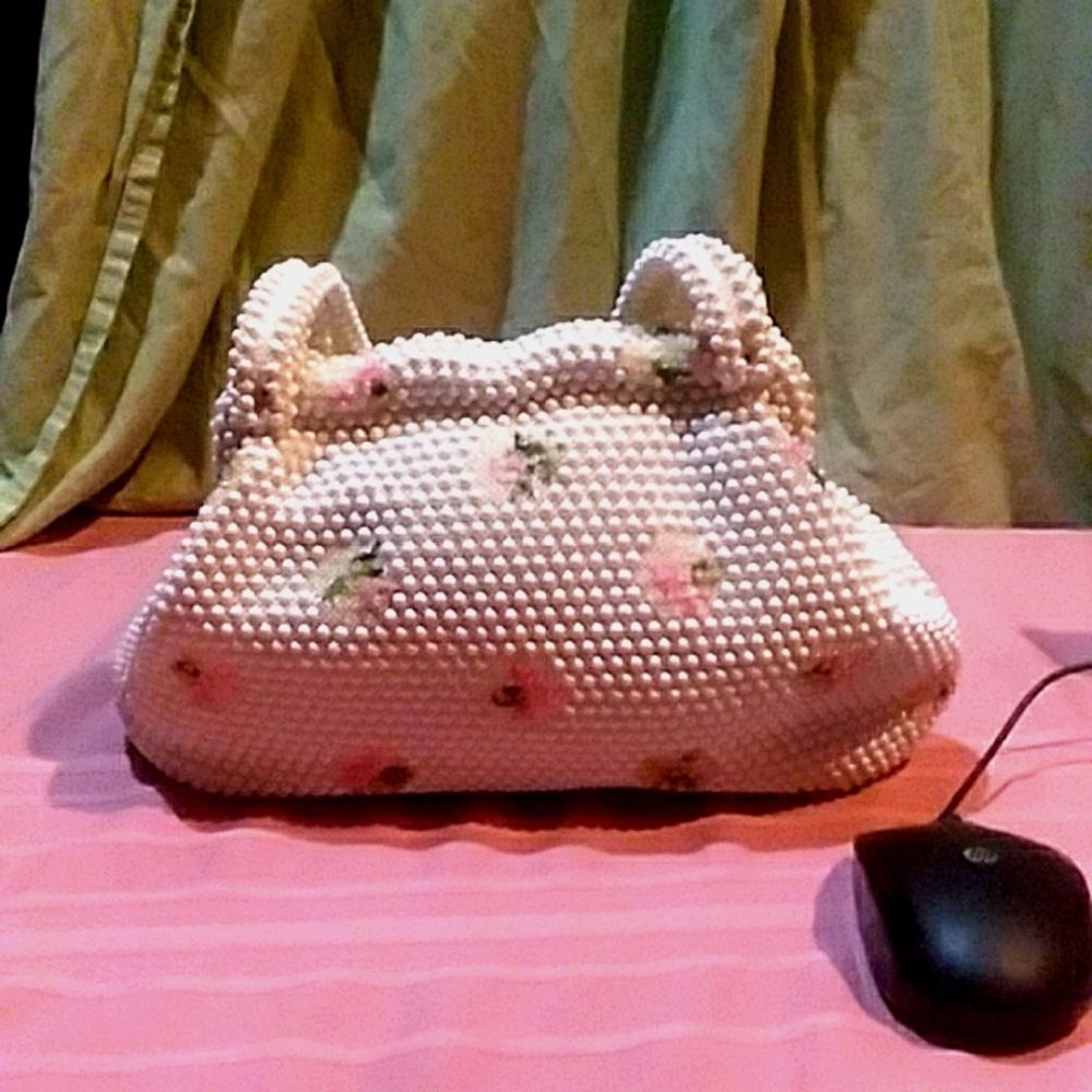 Vintage Lamared purse pearl like with pink and green flowers embellished body.